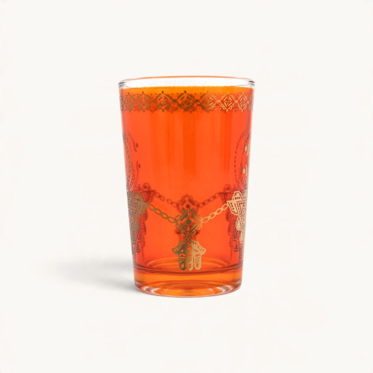 TUYYA Fibule tea cup in vibrant orange glass with intricate gold filigree patterns for traditional Moroccan tea
