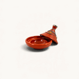 TUYYA handcrafted terracotta mini tajine with silver metal ornaments and a handpainted lid on a white background.