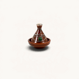 TUYYA handcrafted brown ceramic mini tajine with silver metal ornaments and a green stone accent on a white background