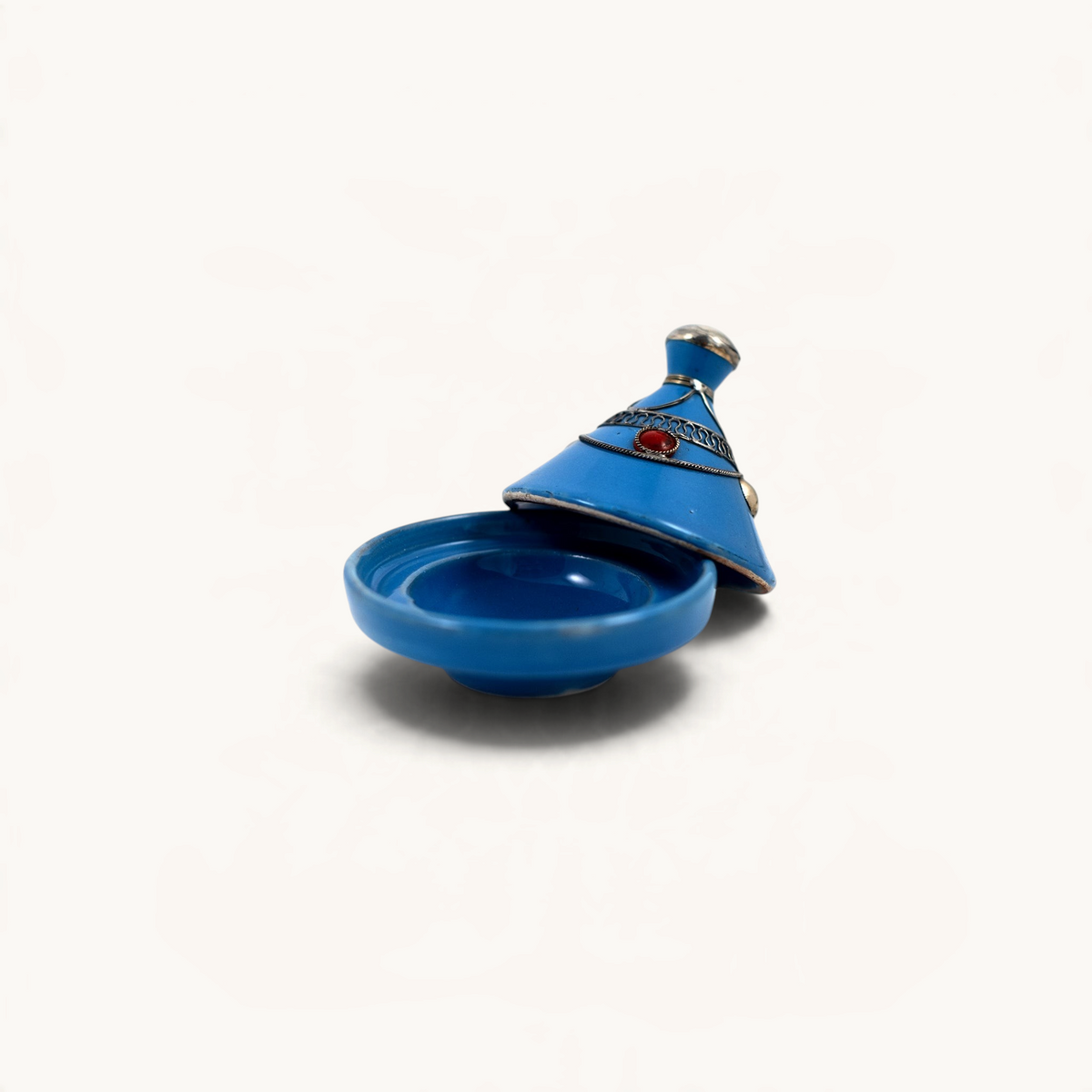 TUYYA handcrafted blue ceramic mini tajine with silver metal ornaments and a red stone detail on the lid.