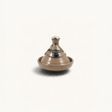 TUYYA handcrafted beige ceramic mini tajine with decorative silver metal ornaments and a blue stone accent
