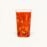 TUYYA 4 oz Moroccan tea glass in vibrant orange with intricate gold floral patterns and traditional craftsmanship