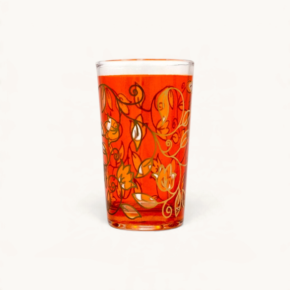 TUYYA 4 oz Moroccan tea glass in vibrant orange with intricate gold floral patterns and traditional craftsmanship