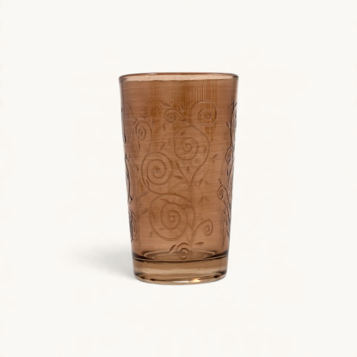 TUYYA Cadencia 4 oz tea glass in amber with intricate swirl patterns and traditional Moroccan design