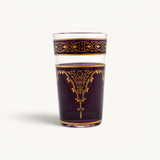 TUYYA Andalousia 4 oz tea cup in deep purple glass with intricate gold Berber pendant and decorative border designs.