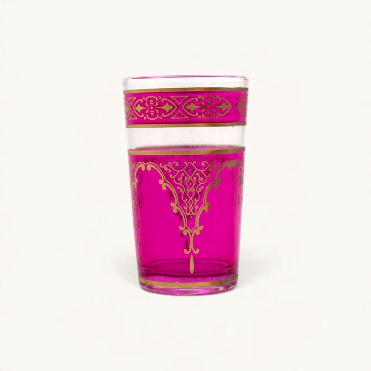 TUYYA Andalousia 4 oz tea cup in vibrant pink glass with intricate gold Berber pendant detailing.