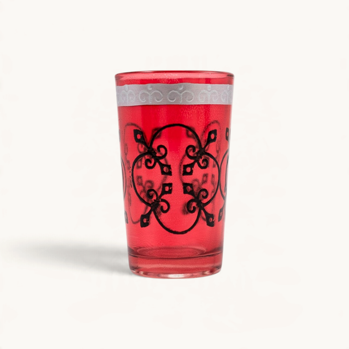 TUYYA Jazz Relief 4 oz red Moroccan tea glass with intricate black patterns and silver rim detailing