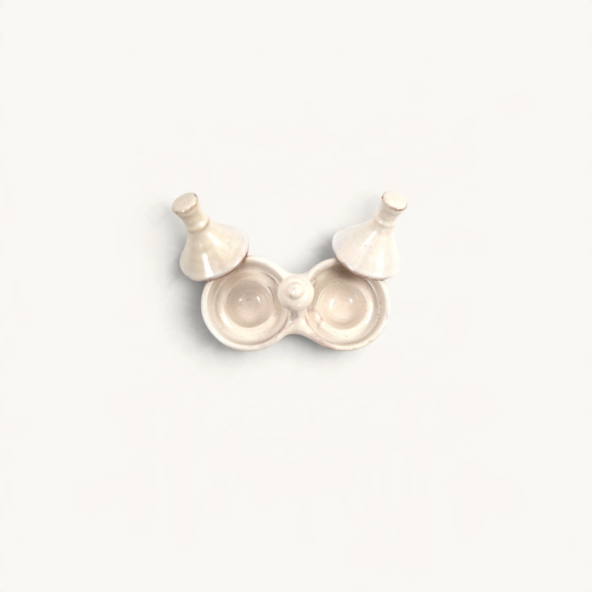 TUYYA handmade ceramic salt and pepper tajine set in a neutral off-white finish for serving condiments.