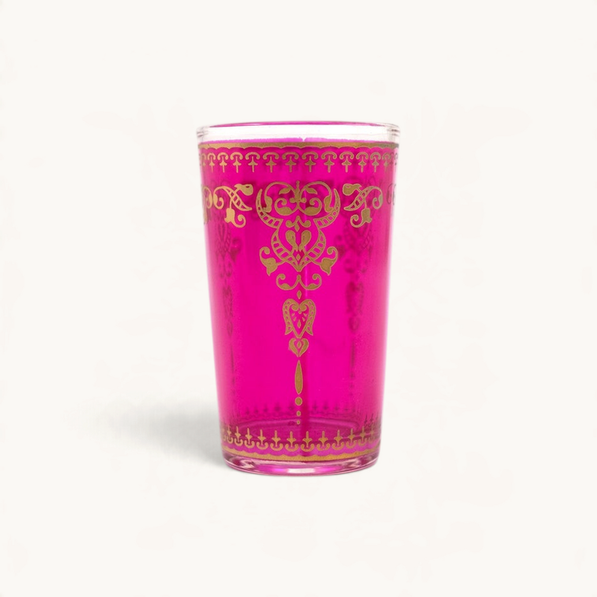 TUYYA Marjana 4 oz tea cup in vibrant pink glass with intricate gold filigree patterns for traditional Moroccan tea.