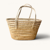 TUYYA Leila minimalist Moroccan wicker basket handcrafted from natural palm leaves with long woven handles
