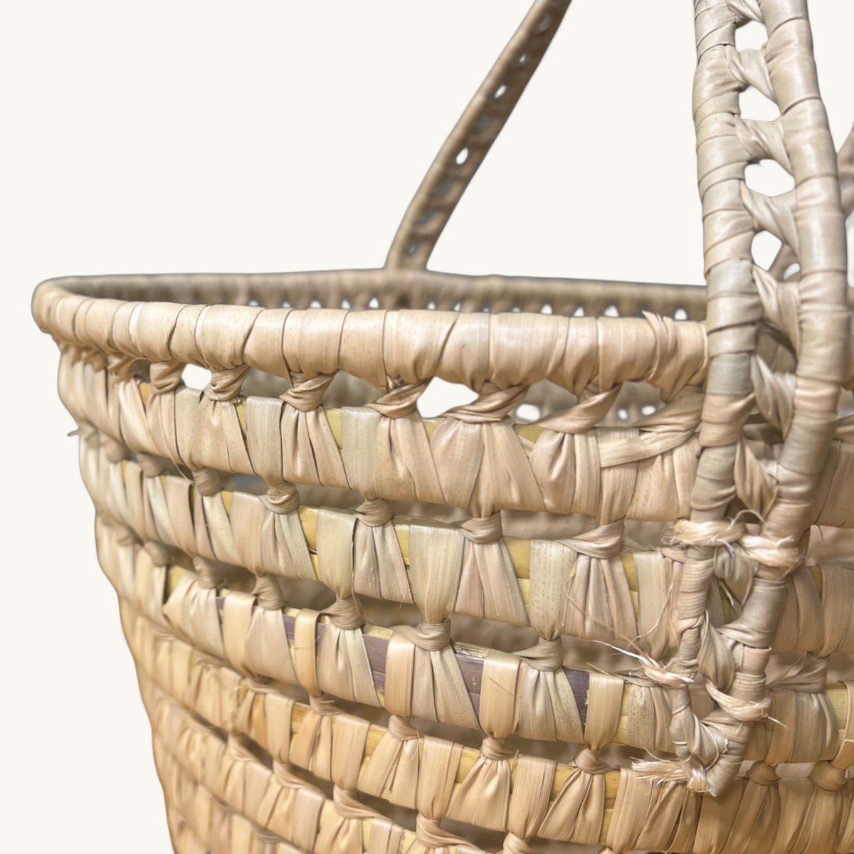TUYYA Leila minimalist Moroccan wicker basket handcrafted from natural palm leaves with woven handles