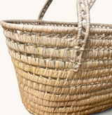 TUYYA Leila minimalist Moroccan wicker basket handcrafted from natural palm leaf with woven handles