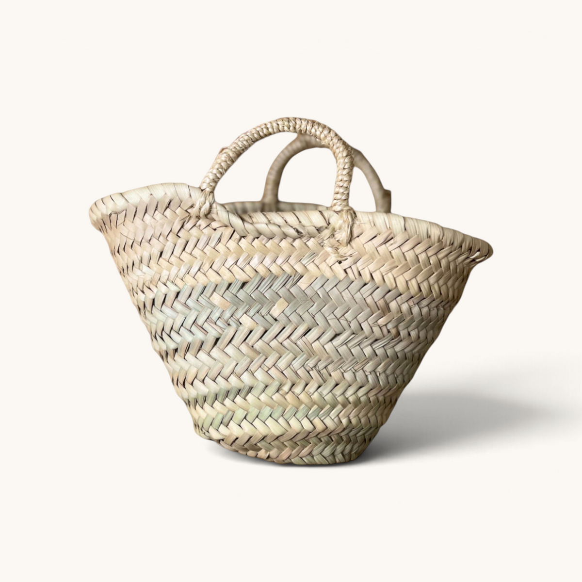 TUYYA Lilou small handwoven Moroccan wicker basket with a simple handle for storage or gift presentation.