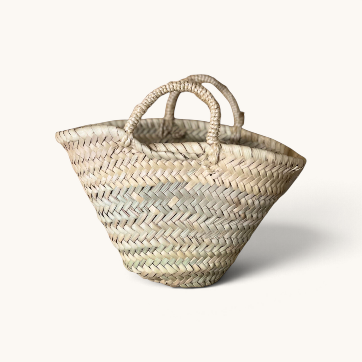 TUYYA Lilou small handwoven Moroccan wicker basket with a simple handle, perfect for storage or gift baskets.