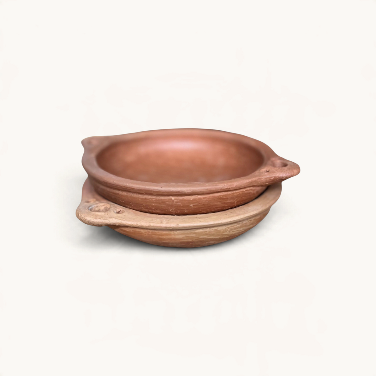 TUYYA handcrafted round unglazed clay tapas dishes from Oued Laou with side handles for serving mezze.