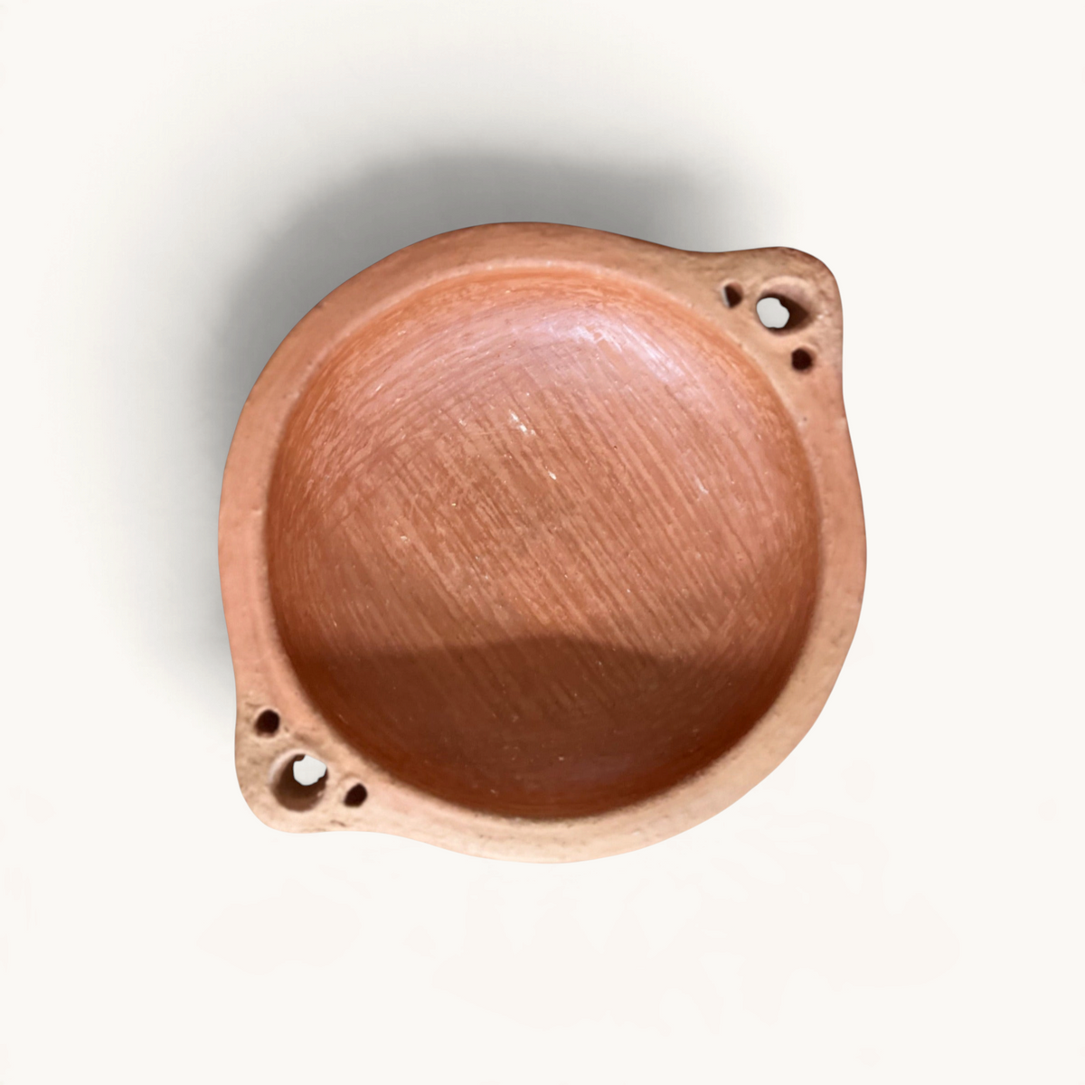 TUYYA handcrafted round unglazed clay tapas dish from Oued Laou with two small handled sides on a white background