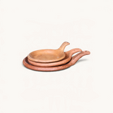TUYYA handcrafted Moroccan unglazed clay cooking pans in three sizes stacked on a white background