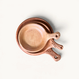 TUYYA handcrafted Moroccan unglazed clay cooking pans in three sizes with textured handles on a white background