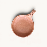TUYYA traditional Moroccan handcrafted unglazed clay cooking pan with a textured handle, top-down view.
