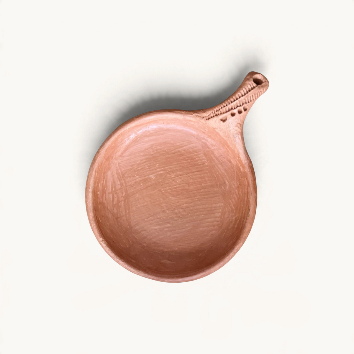 TUYYA traditional Moroccan handcrafted unglazed clay cooking pan with a textured handle, top-down view.