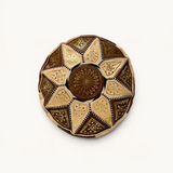 TUYYA hand-stitched goat leather ottoman in brown and sand patchwork with intricate gold floral embroidery.