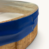 TUYYA handcrafted Moroccan wooden sieve with a blue rim and fine mesh, showing traditional bentwood construction.