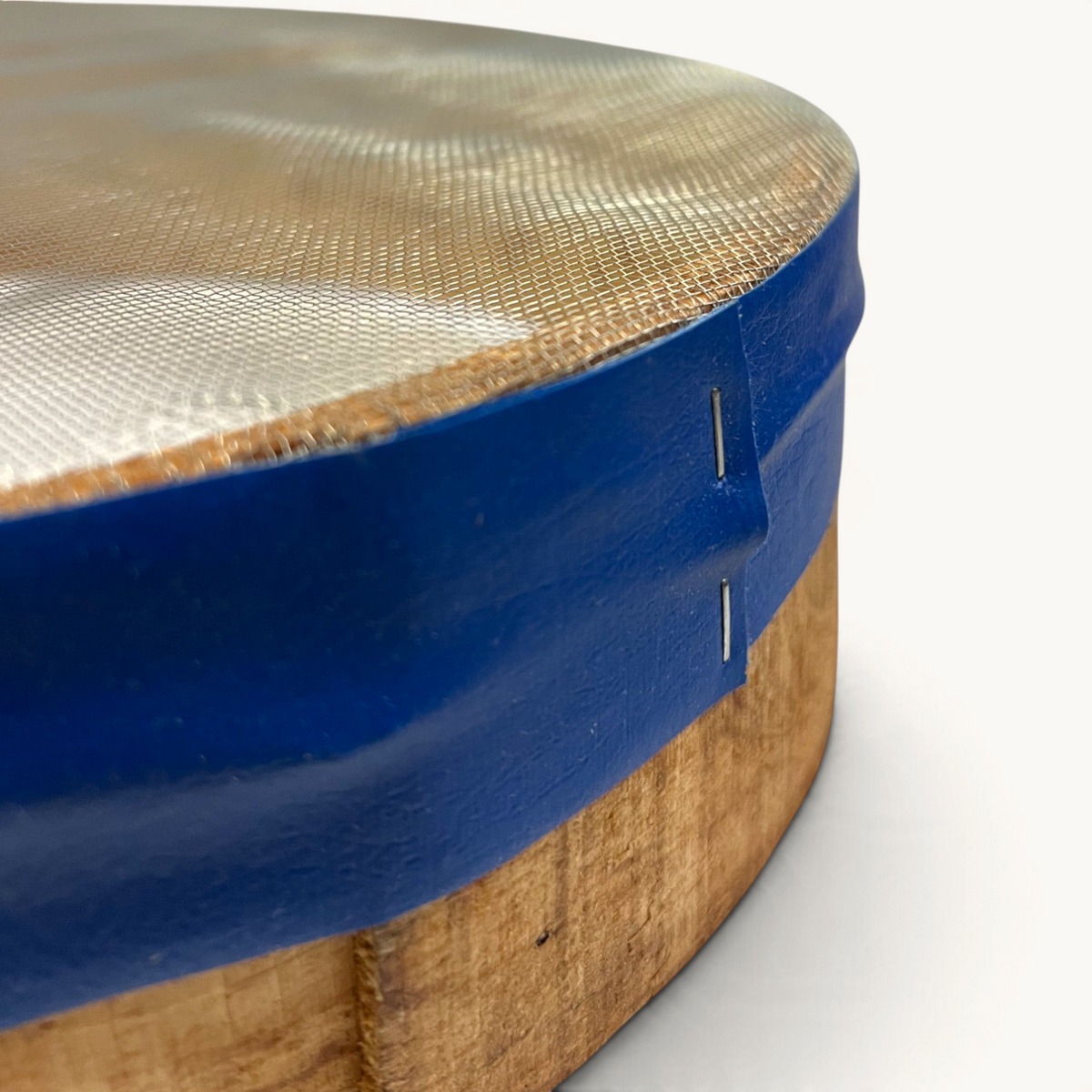 TUYYA handcrafted Moroccan wooden sieve with a blue rim and fine mesh, showing traditional bentwood construction.