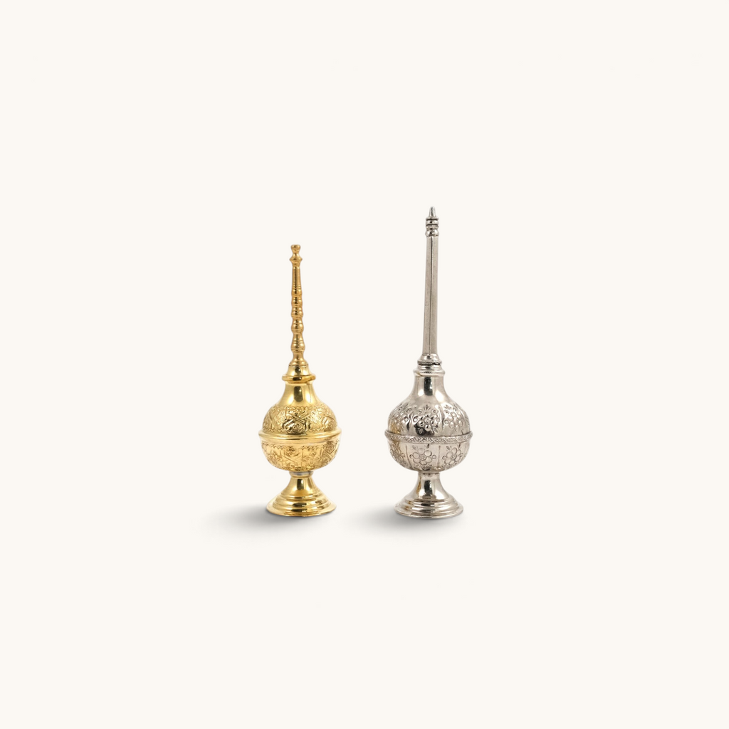 tuyya handcrafted yellow copper and silver Moroccan rose water sprinkler bottles with intricate embossed designs