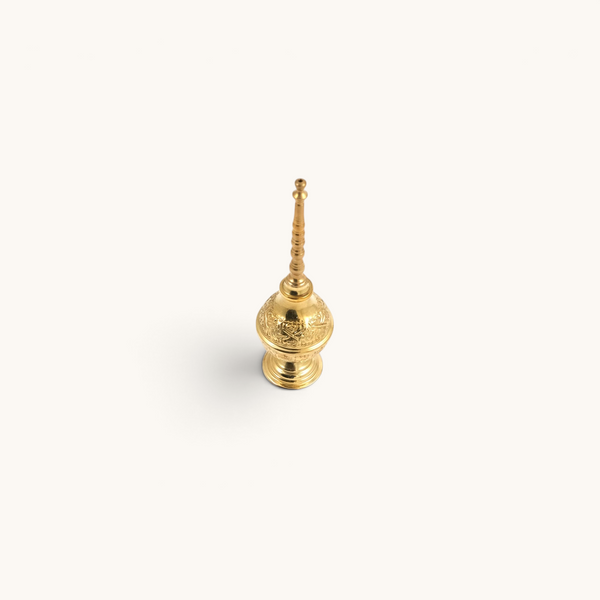 tuyya handcrafted yellow copper Moroccan rose water sprinkler bottle with intricate hand-embossed floral patterns