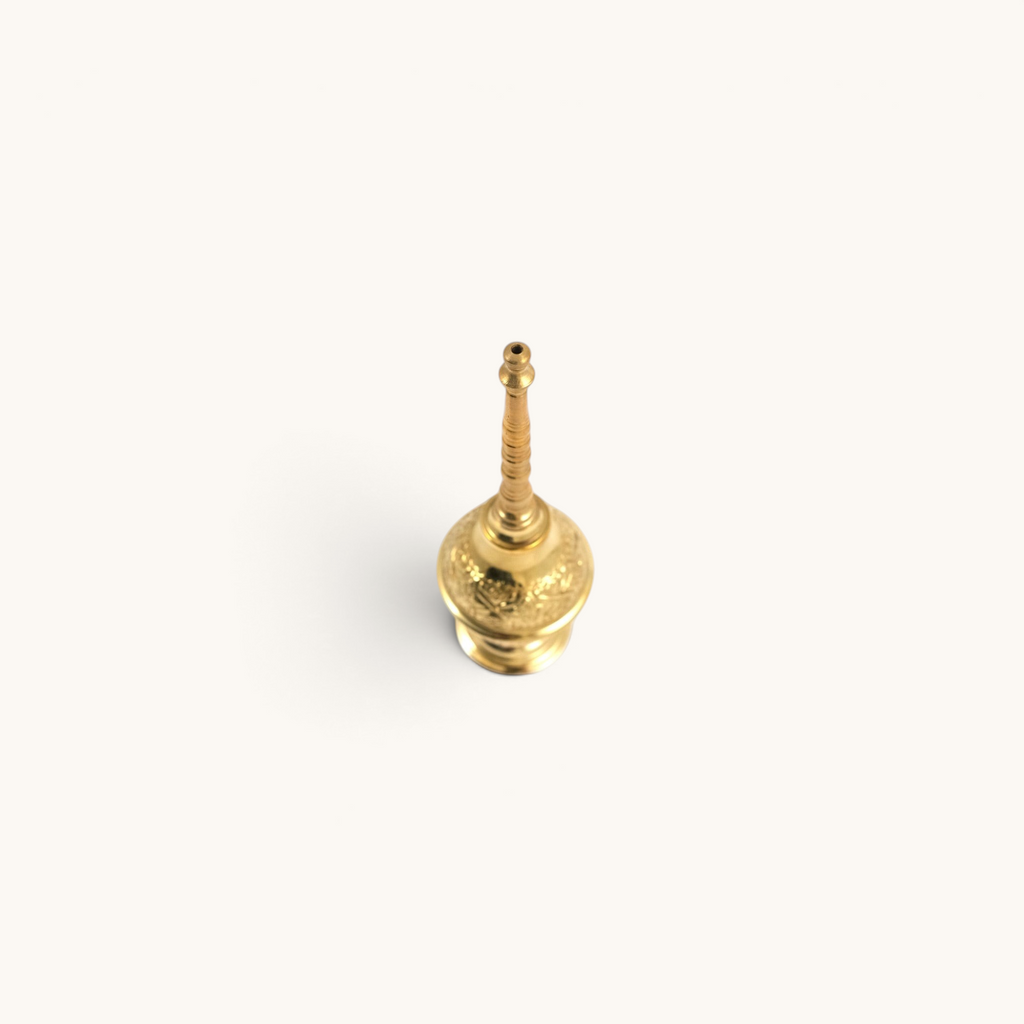 tuyya handcrafted yellow copper Moroccan rose water sprinkler bottle with intricate embossed floral patterns
