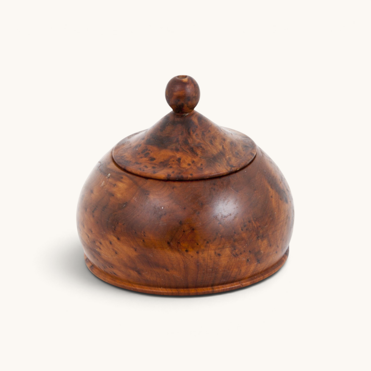 A uniquely drop-shaped Thuya Woodbox exhibiting Moroccan Folk Art Deco, beautifully crafted from thuya root's wood by TUYYA.