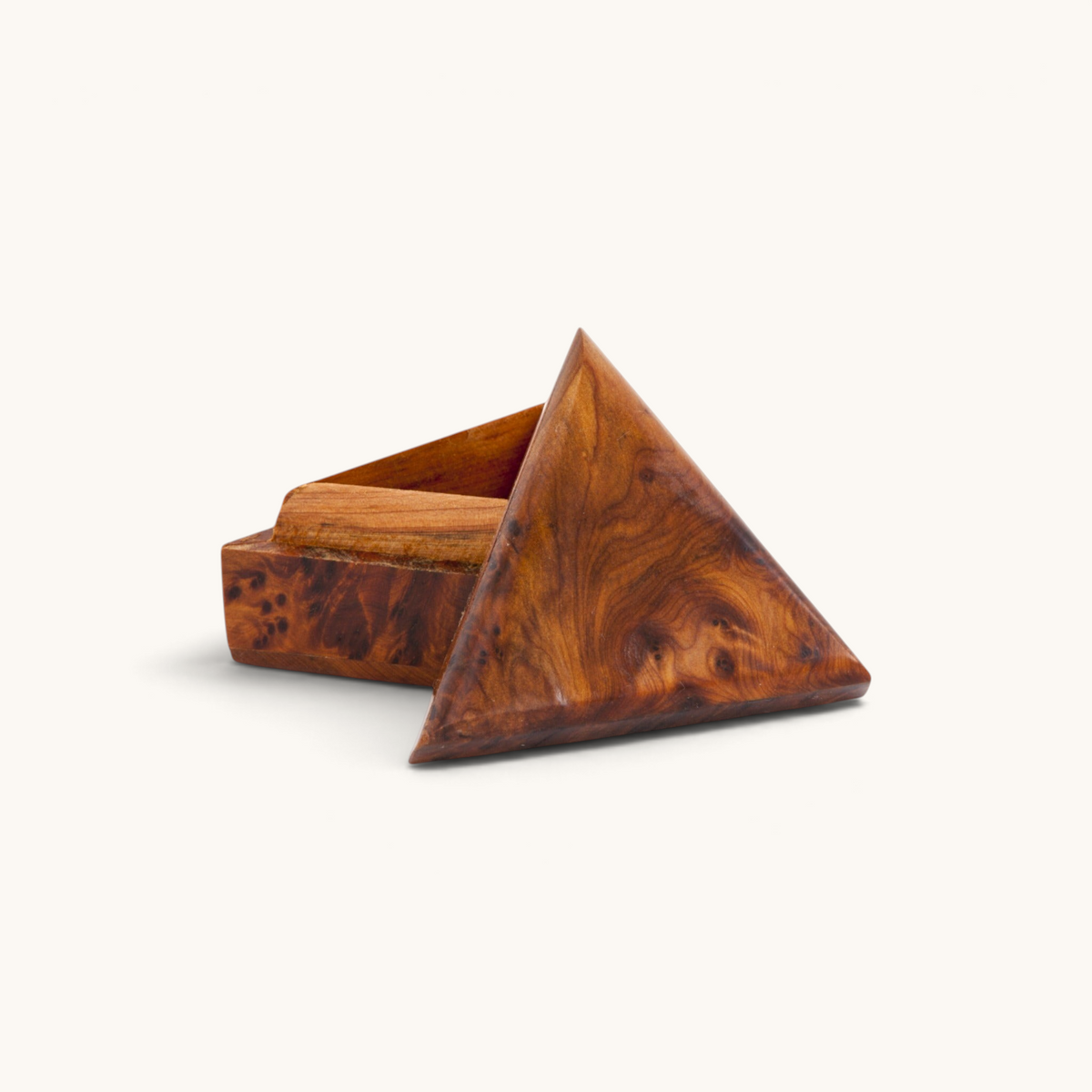 A small, unique triangular Thuya Woodbox handcrafted from the intricately-grained thuya root's wood by TUYYA.