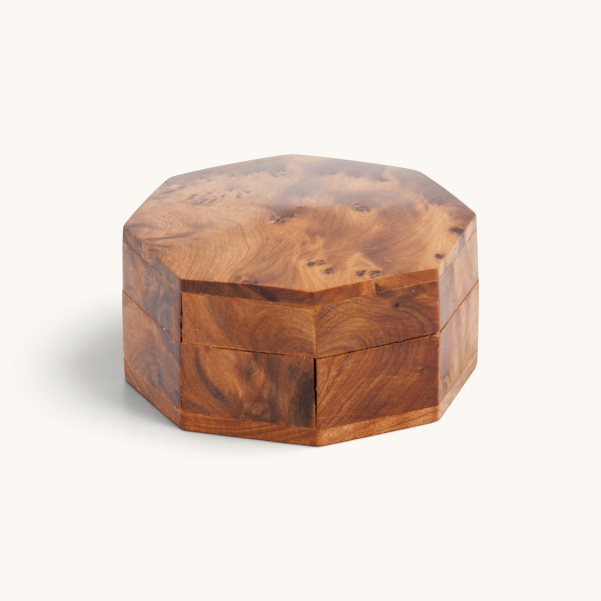 A beautifully crafted medium octagonal thuya woodbox by TUYYA showcasing the mesmerizing swirled grain of thuya root's wood.