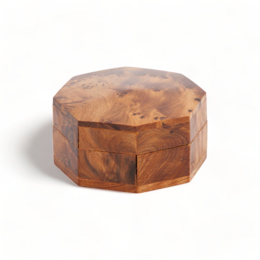 A beautifully crafted medium octagonal thuya woodbox by TUYYA showcasing the mesmerizing swirled grain of thuya root's wood.