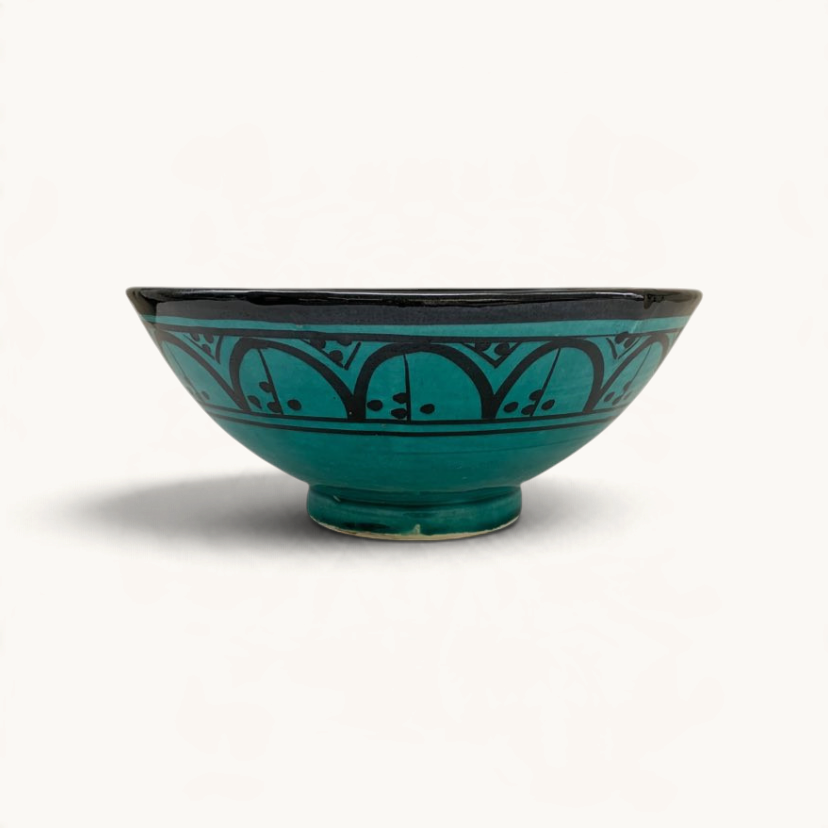 TUYYA handmade green ceramic bowl from Safi, Morocco, featuring a traditional black hand-painted geometric pattern.