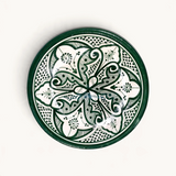 TUYYA handmade Moroccan ceramic bowl in dark green and white with intricate floral patterns and dotted details.