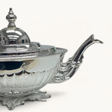 TUYYA Manchester Britishtime silver-plated teapot with ornate legs and a classic silhouette on a white background.