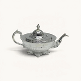 TUYYA Manchester Britishtime silver-plated teapot with ornate legs and a classic lid, showcasing elegant craftsmanship.