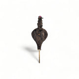 Encarved Moroccan Rabouz, showcasing Berber patterns and calligraphy of "Maroc," camel, and Marrakech Kasbah, used for igniting fires or as a decorative piece.