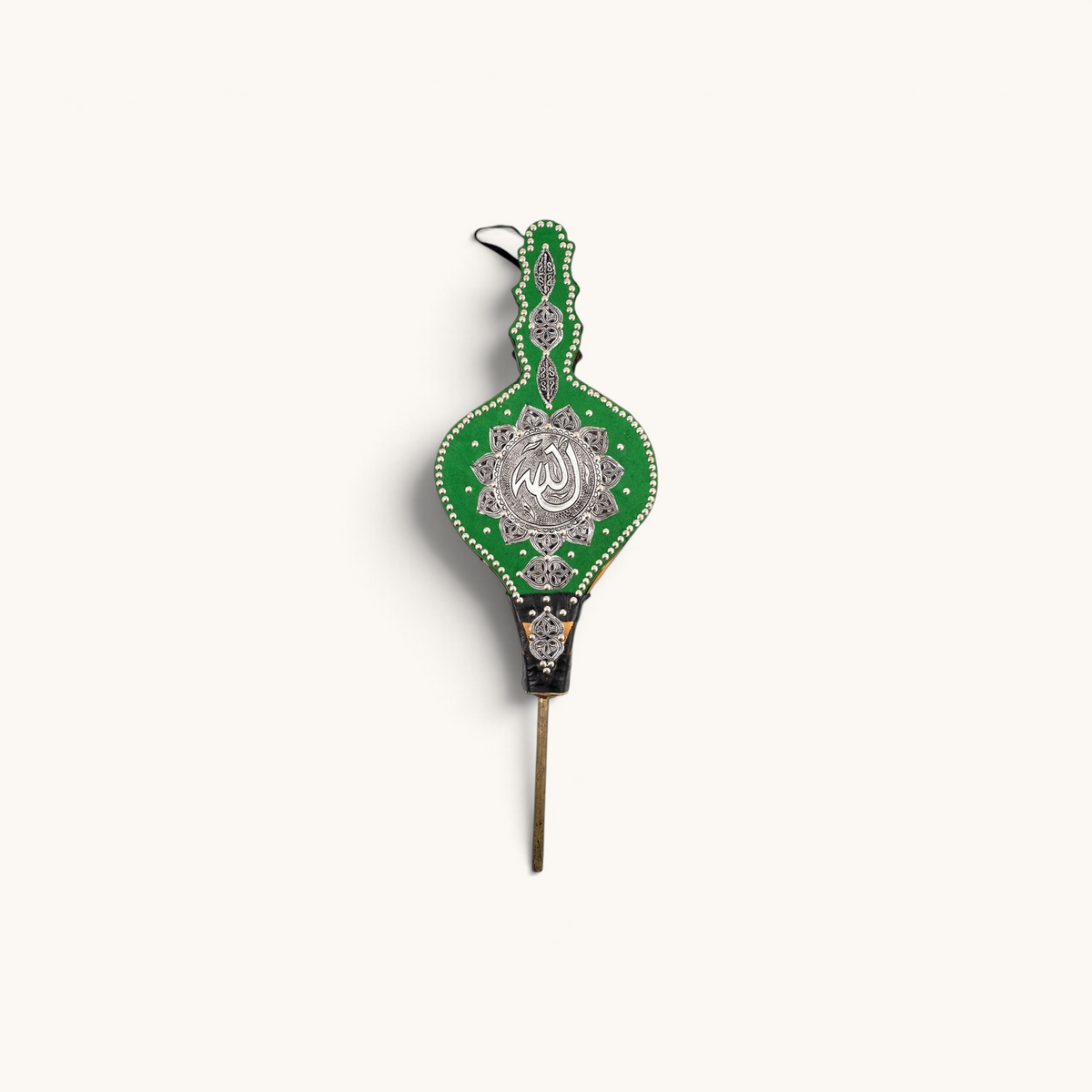 Traditional Moroccan Rabouz with Berber design, used for igniting fires or as a decorative piece, showcasing intricate ciseled patterns and green fabric accents.