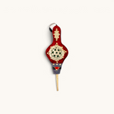 Red Small Moroccan Rabouz with Berber patterns and concentric stars design, adorned with copper rivets for a traditional look.