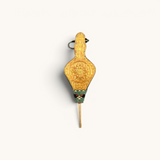 TUYYA handcrafted Moroccan Rabouz fire blower made of wood, green leatherette, and intricately chiseled copper.