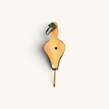TUYYA handcrafted Moroccan Rabouz fire blower featuring wood, green leatherette, and a copper nozzle.