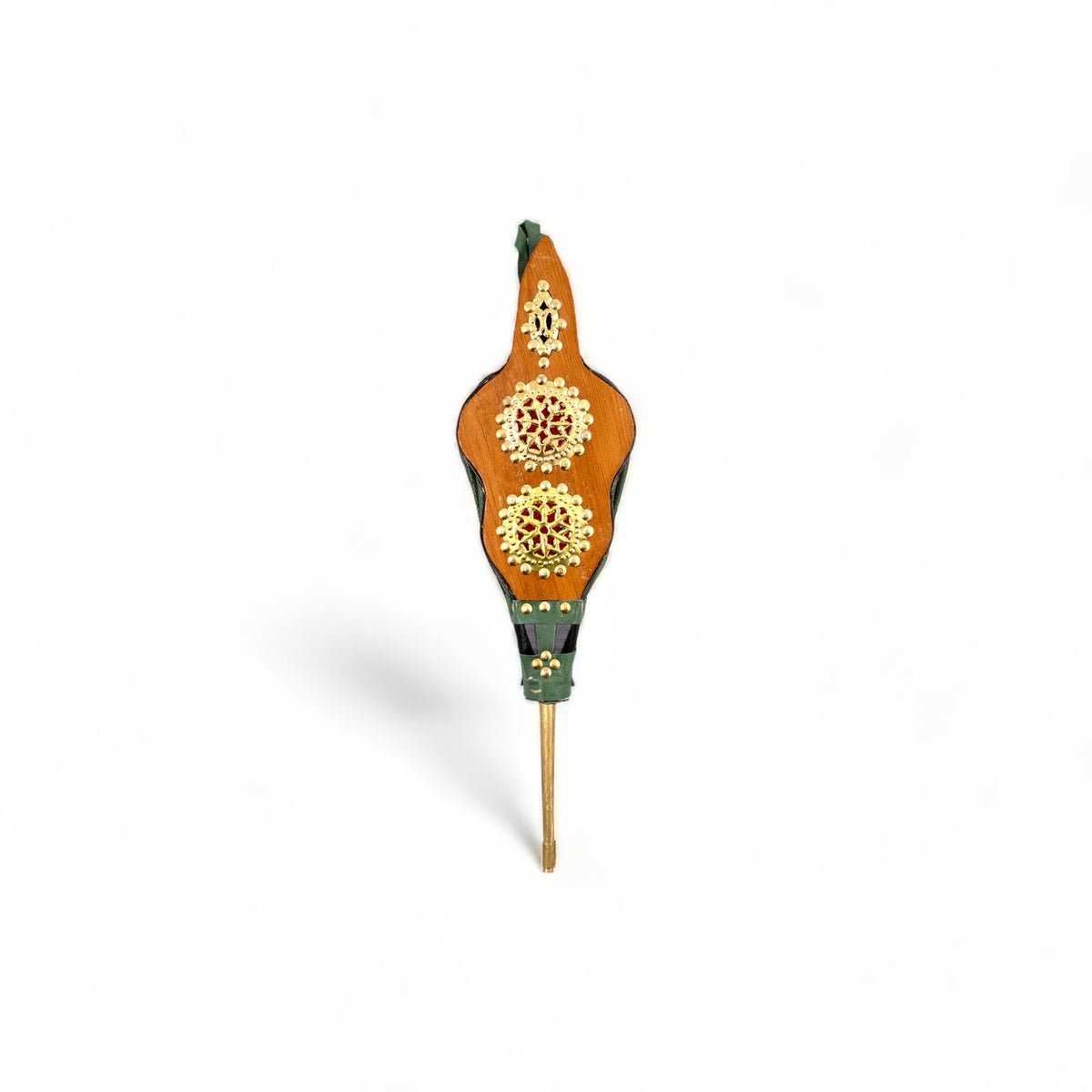 Moroccan Rabouz with green leatherette facade, featuring horizontal copper circles with concentric stars in a Berber pattern. A symbol of artistry and tradition.