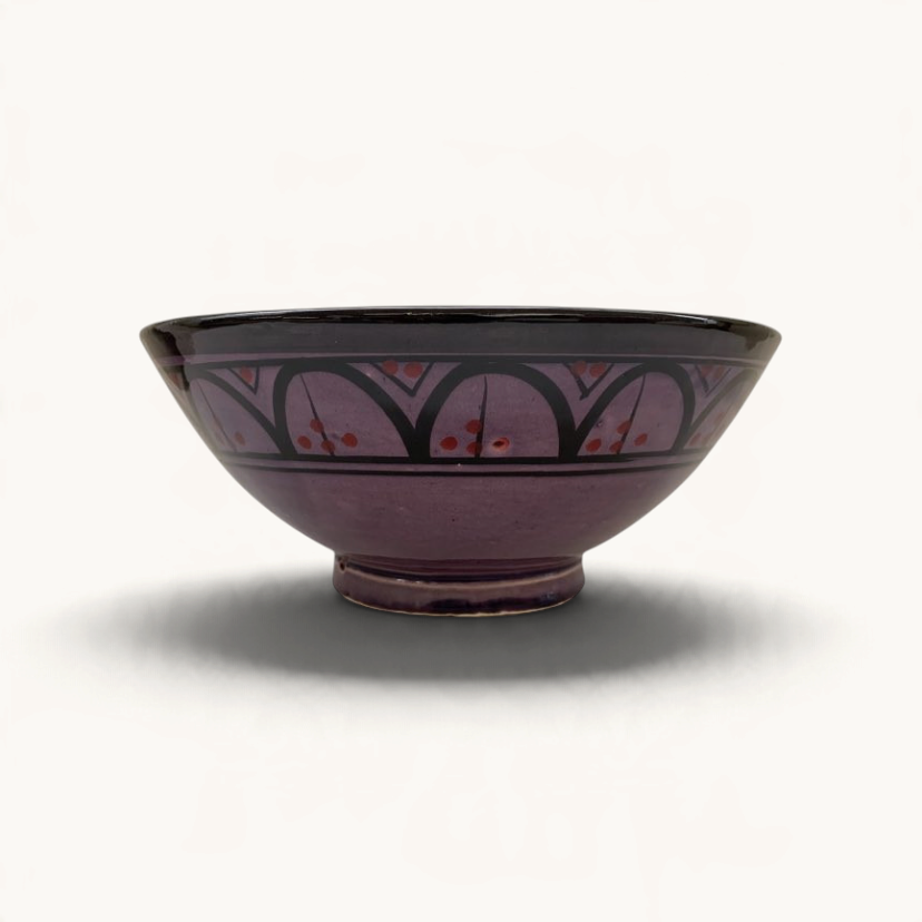 TUYYA handmade Moroccan ceramic bowl in vivid purple with traditional black and red painted geometric patterns.