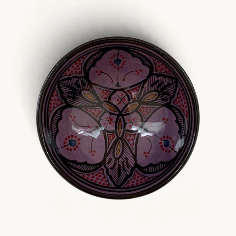 TUYYA handmade Moroccan ceramic bowl in vivid purple with intricate traditional patterns, top-down view.