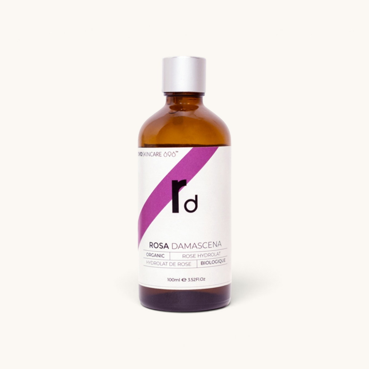 100ml bottle of OVO Skincare's Moroccan Rose Damascena Distillate with a dropper.