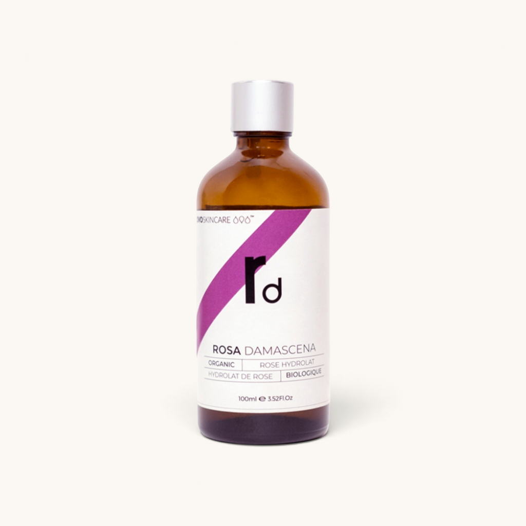 100ml bottle of OVO Skincare's Moroccan Rose Damascena Distillate with a dropper.