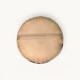 TUYYA round Moroccan goat leather ottoman in brown and sand with a bottom zipper closure