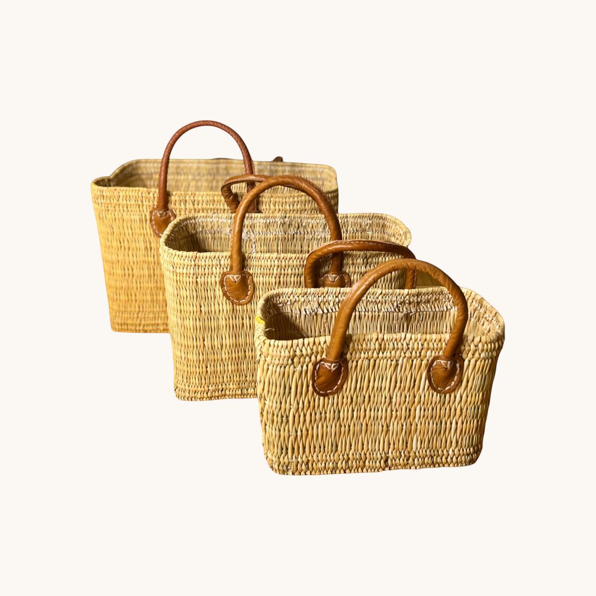tuyya Yasmine structured Moroccan wicker baskets in three sizes with camel leather handles and rivet details